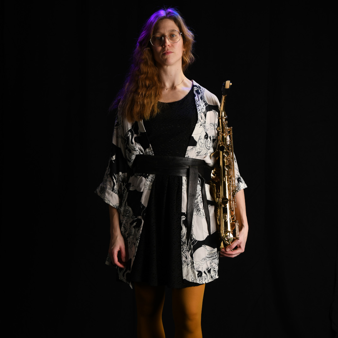 A photo of Madeleine Dietrichstein holding a saxophone